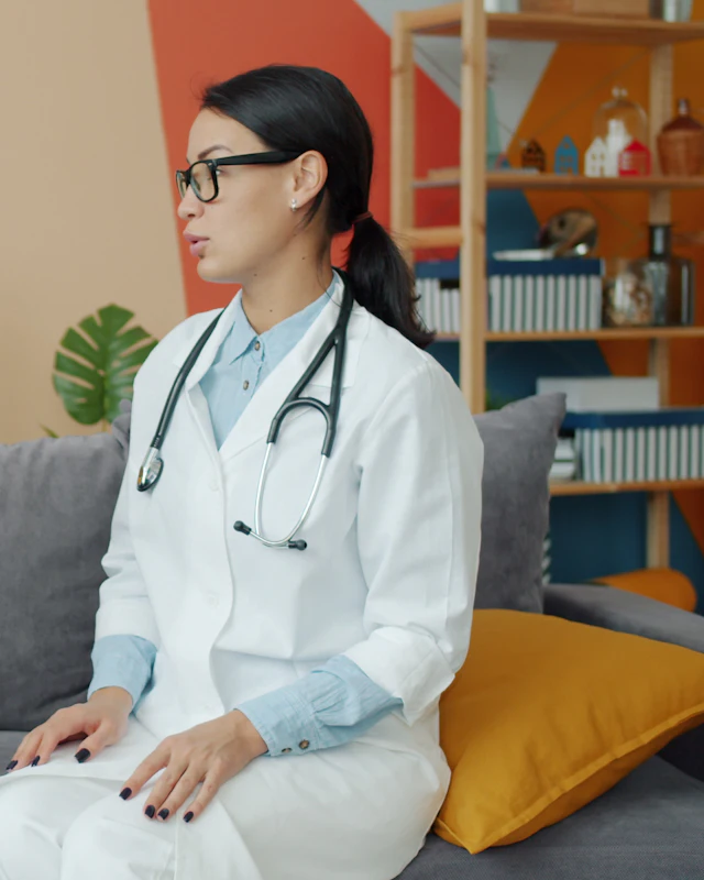 A doctor in a white coat with a stethoscope